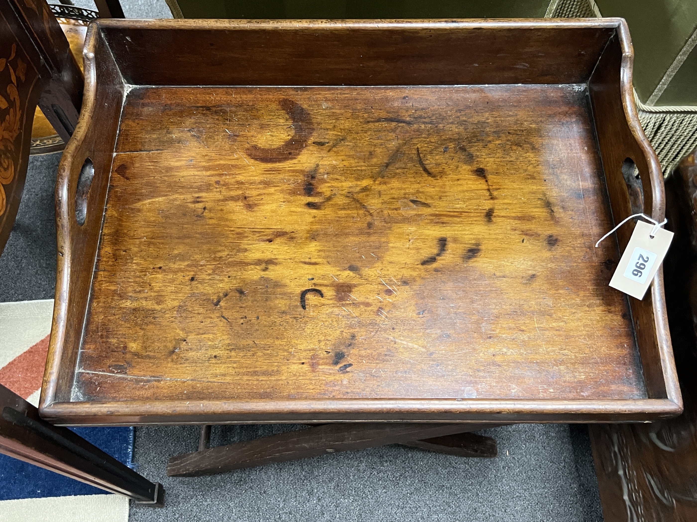 A small Victorian rectangular mahogany butler's tray on folding stand, width 58cm, depth 42cm, height 55cm